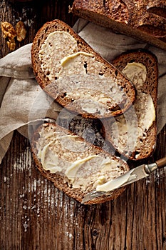 Slices of rustic sourdough bread with homemade butter