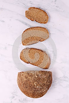 Slices of Rye Bread on the table, top view, vertical