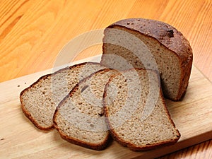 Slices of rye bread on a wooden board