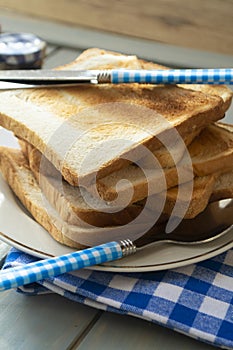 Slices of rye dry bread as toast for breakfast with vintage knife