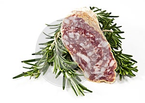 Slices of salame and rosemary photo