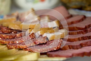 Slices of sausage, ham and cheese