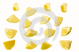 Slices of sliced lemon isolated on a white in a chaotic manner