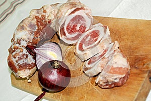 Slices of smoked rolled pork meat