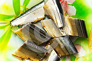 Slices of smoked saury fish on plate