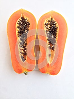 Slices of sweet papaya on white background