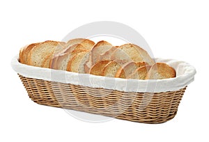 Slices of toasted bread in basket on background