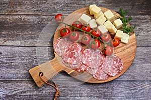 Slices Of Traditional Italian antipasti salame Milano and parmesan cheese