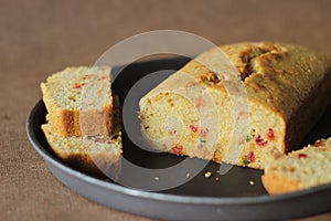 Slices of tutti frutti cake loaf made with whole wheat flour