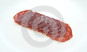 Slices of uncured soppressata dry salami in a row