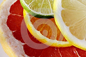 Slices of various citrus fruits as ingredients for the preparation of summer vitamin drink.