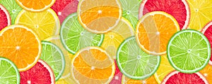 Slices of various citrus fruits background.