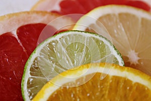 Slices of various citrus fruits as ingredients for the preparation of summer vitamin drink.