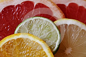 Slices of various citrus fruits as ingredients for the preparation of summer vitamin drink.