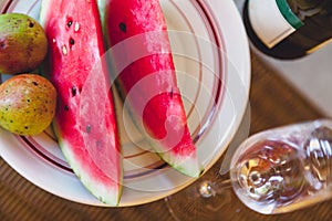 Slices of watermelon and pears lie on plate