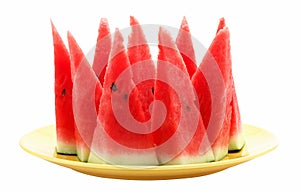 Slices of watermelon on yellow plate isolated on white background