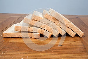 Slices of white bread on a kitchen table photo