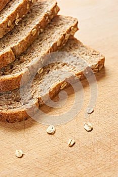 Slices of wholegrain bread on a wooden cutting board