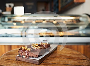 Slices of yummy chocolate cake sitting on a bakery table