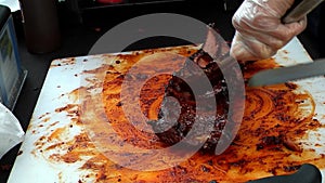 Slicing Barbequed Ribs at Street Fair