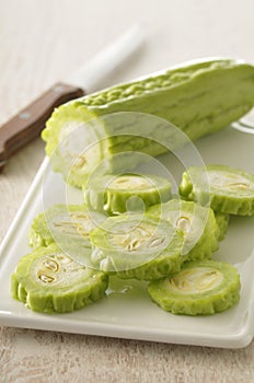 Slicing a bitter cucumber