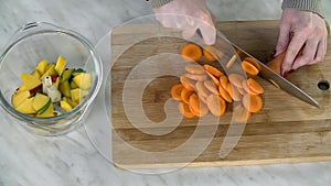 Slicing carrots into pieces