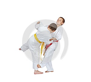 Slicing down under leg are training athletes in judogi