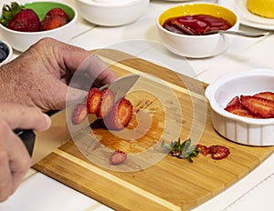 Slicing Fresh Strawberries on Cutting Board III