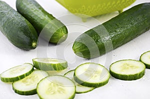 Slicing green cucumbers photo