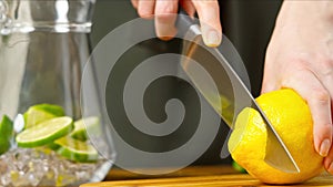 Slicing lemon on kitchen board