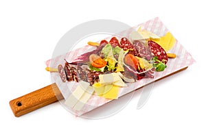 Slicing of meat, cheese and vegetables on cutting board on isolated background