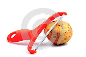 Slicing potatoes. Potato peeler. on a white isolated background. Slicer. Professional