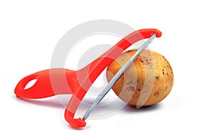 Slicing potatoes. Potato peeler. on a white isolated background. Slicer. Professional