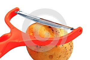 Slicing potatoes. Potato peeler. on a white isolated background. Slicer. Professional