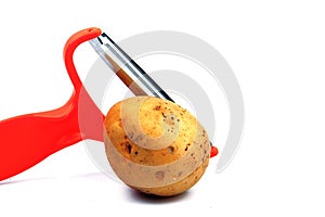 Slicing potatoes. Potato peeler. on a white isolated background. Slicer. Professional