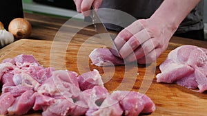 Slicing raw meat steak prepared food.