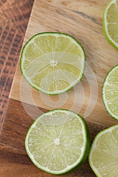 Slicing these vibrant limes in half, ready to add a burst of tangy flavor to my dishes