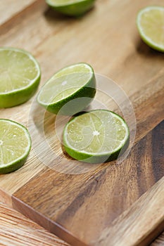 Slicing these vibrant limes in half, ready to add a burst of tangy flavor to my dishes