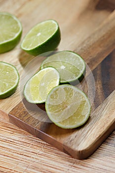 Slicing these vibrant limes in half, ready to add a burst of tangy flavor to my dishes