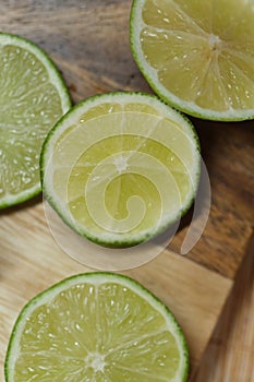 Slicing these vibrant limes in half, ready to add a burst of tangy flavor to my dishes