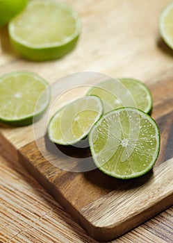 Slicing these vibrant limes in half, ready to add a burst of tangy flavor to my dishes