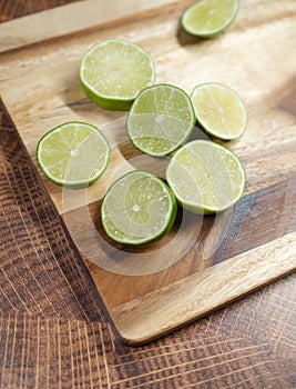 Slicing these vibrant limes in half, ready to add a burst of tangy flavor to my dishes