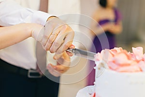 Slicing wedding cake