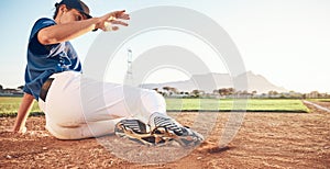 Slide, baseball action and player in dirt for game or sports competition on a pitch in a stadium. Man, ground and