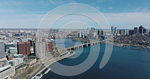 Slide and pan shot of Wide Charles river at Longfellow Bridge. Urban boroughs on waterfronts. Boston, USA