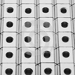 Slide nuts in a row, industrial background photo