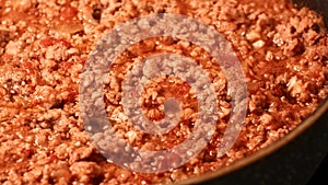 Slide shot of preparing bolognese sauce on the pan