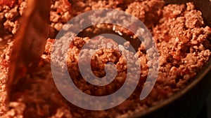 Slide shot of preparing bolognese sauce on the pan