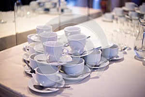 A slide of tea cups on saucers