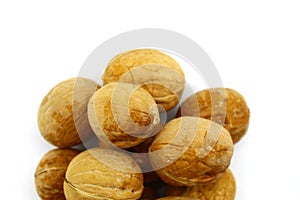 Slide of walnuts in a shell on a white background